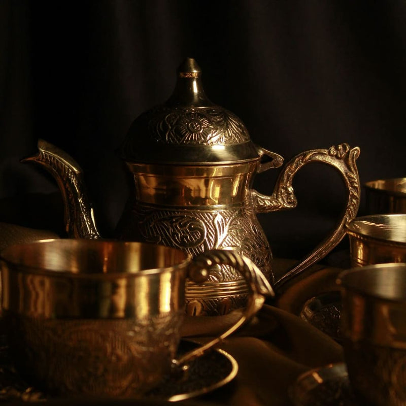 https://codesustain.in/cdn/shop/files/gold-brass-tea-cup-set-coffee-small-pot-with-2-cups-and-saucers-128_800x.jpg?v=1710343520