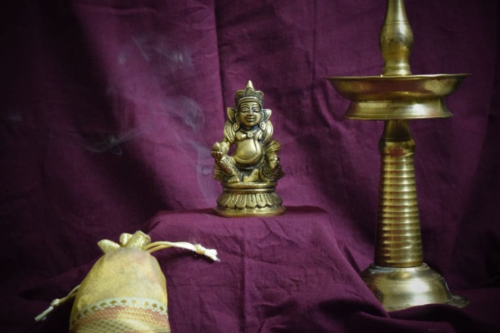 Yamas Lord Kuber Idol with Dhan Potli - Codesustain